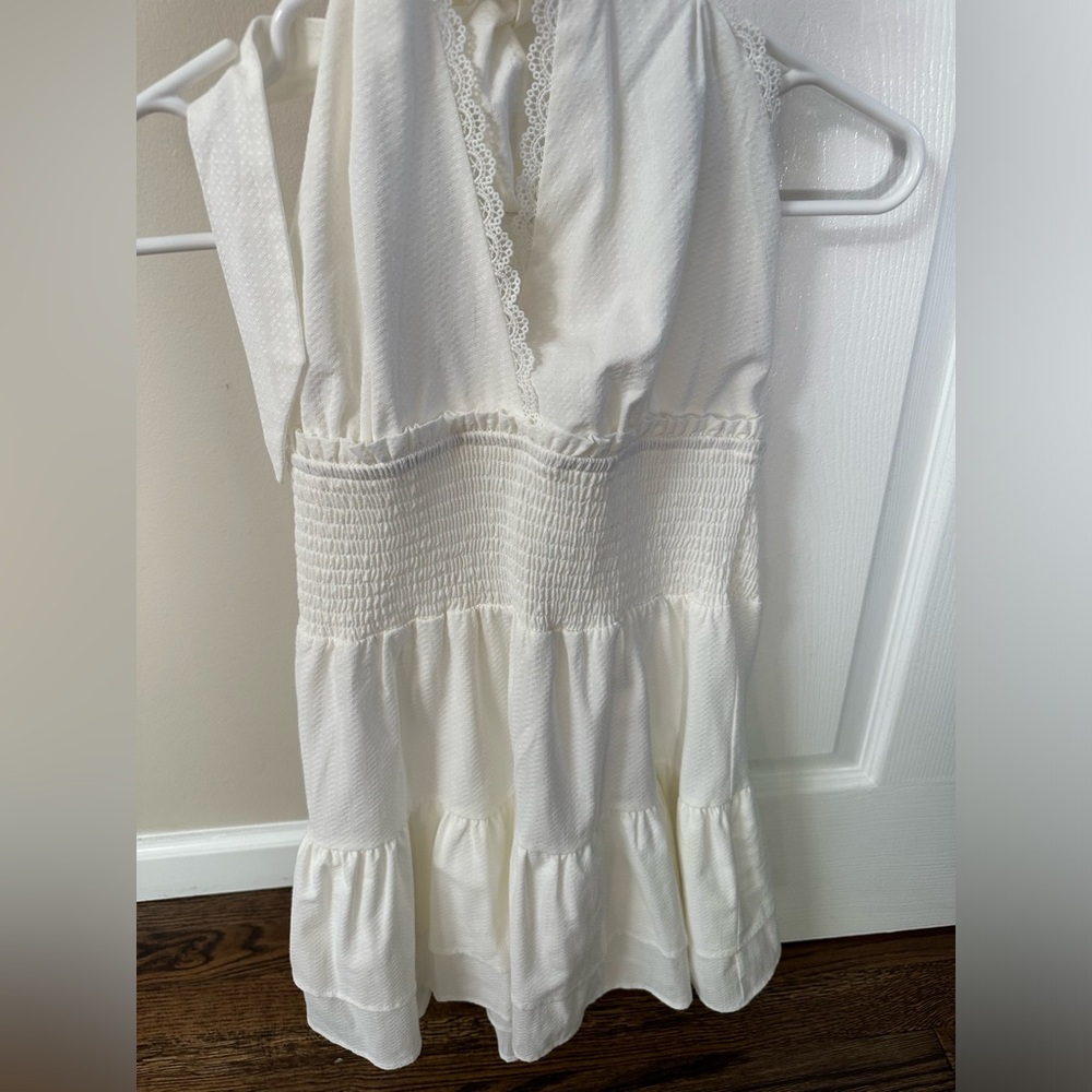 We’re all pretty girls, white halter mini dress